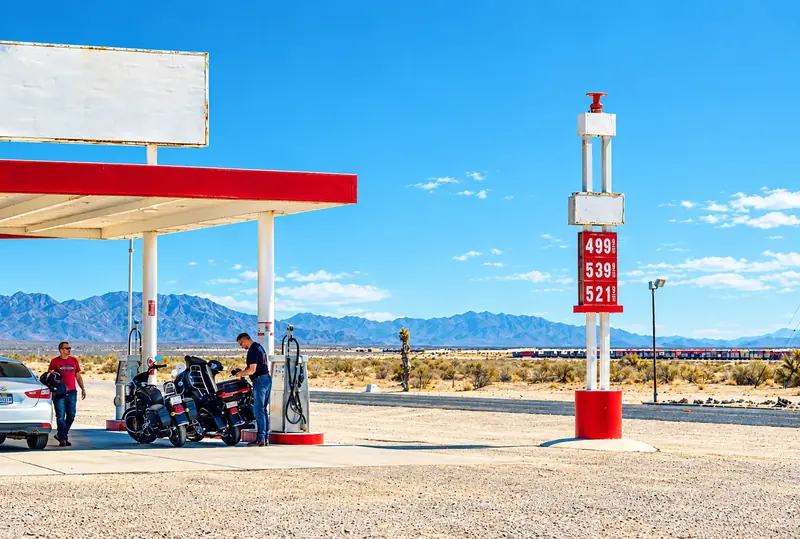 Desert highway gas station with motorcycles