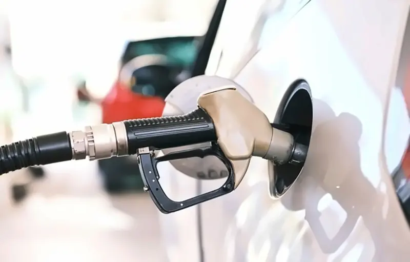 Fuel nozzle ready to fill a vehicle